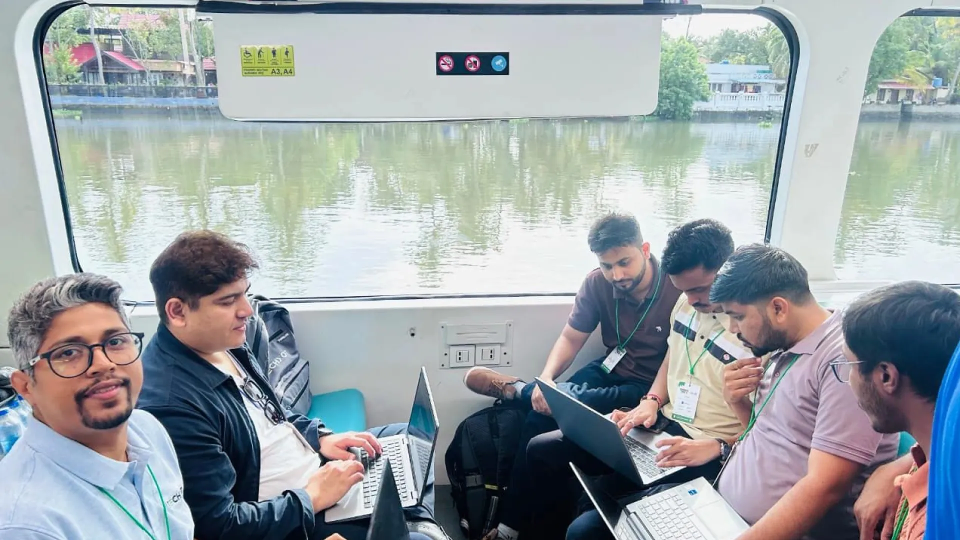 Developers coding and networking during Hack on the Waves at Umbraco India Festival 2026